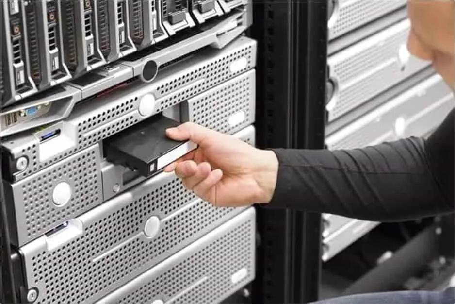 Inserting a cartridge into a tape backup drive